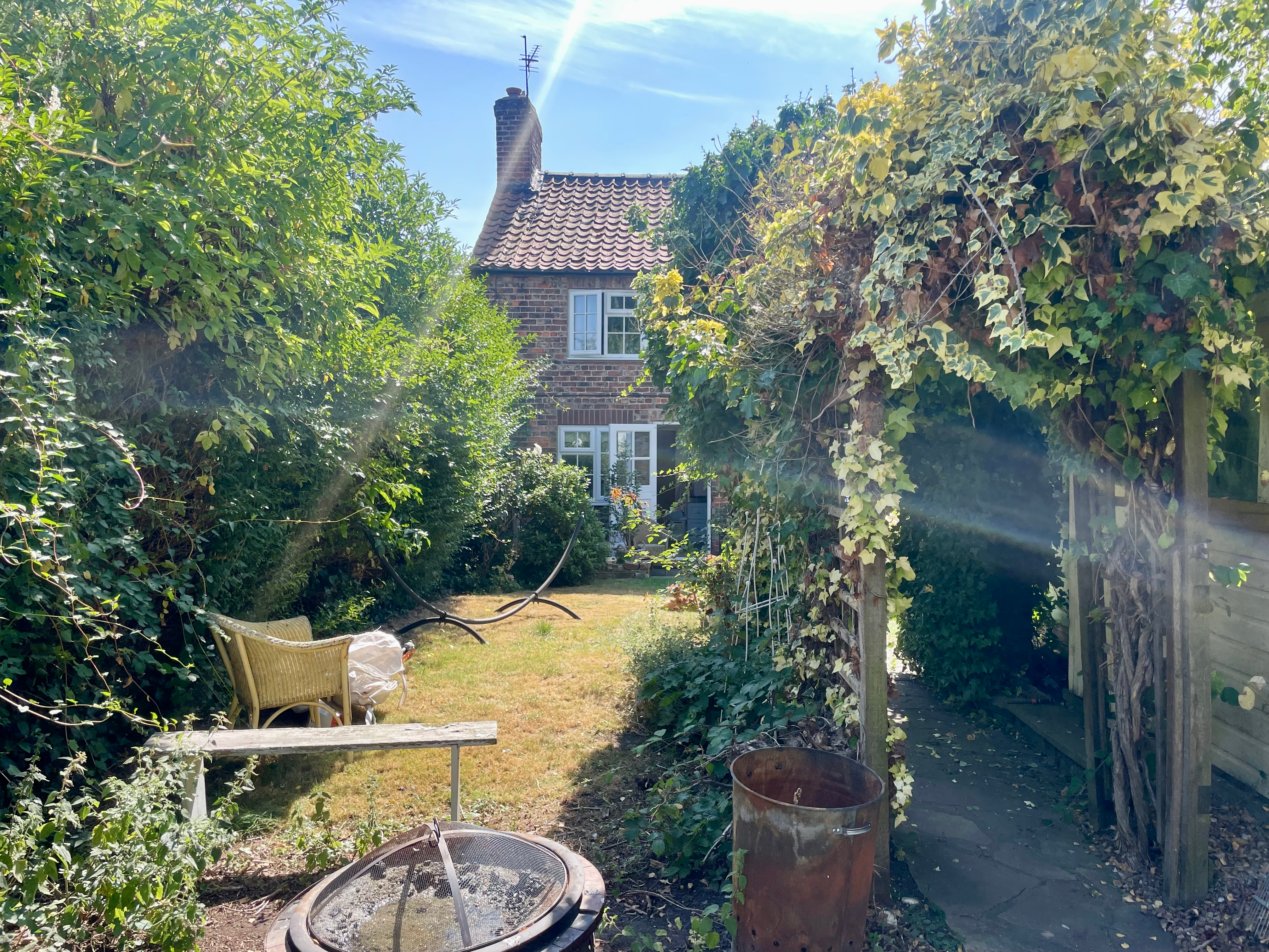 Before: Neglected border — cleared and replanted