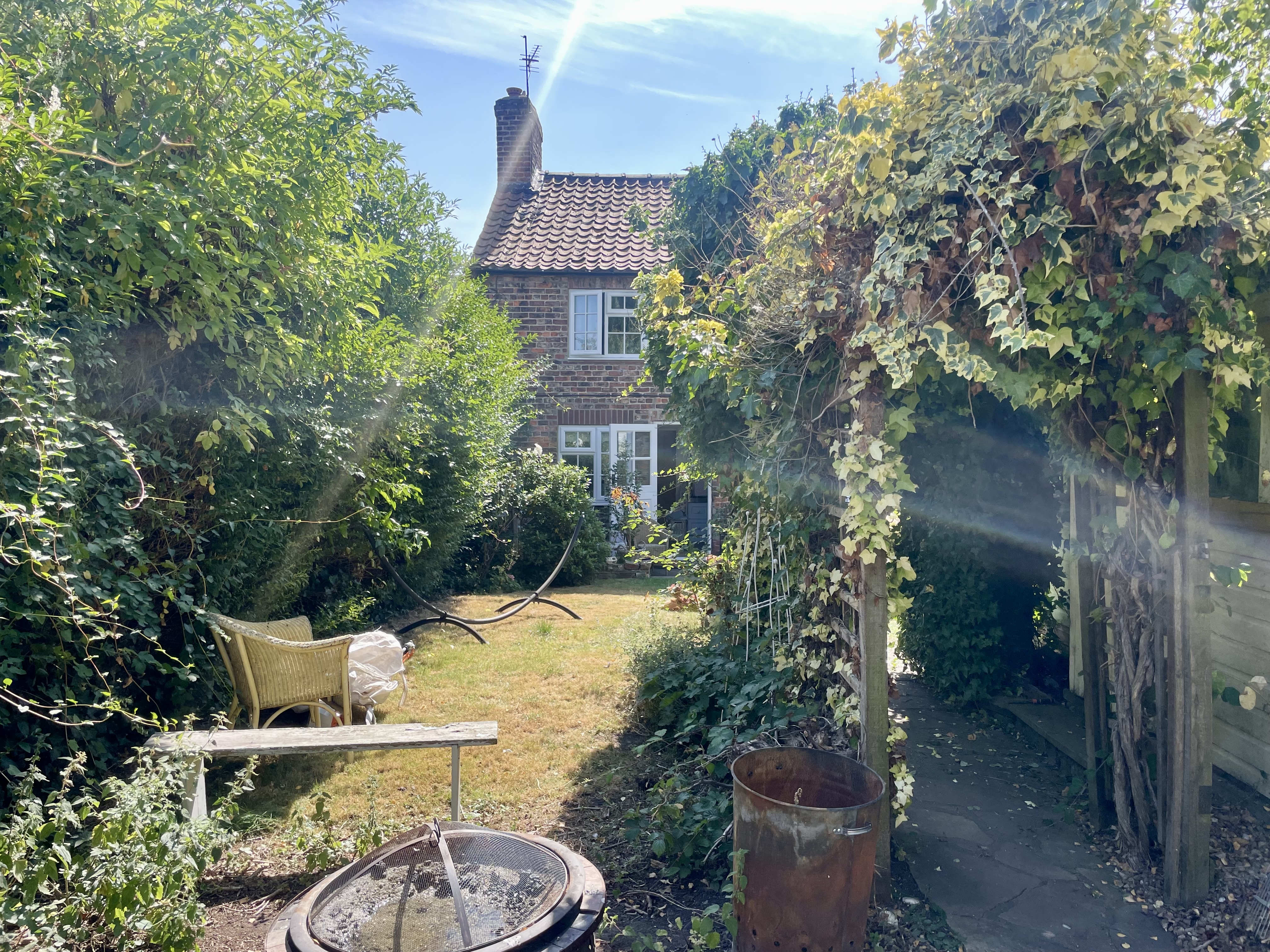 Before: Neglected border — cleared and replanted