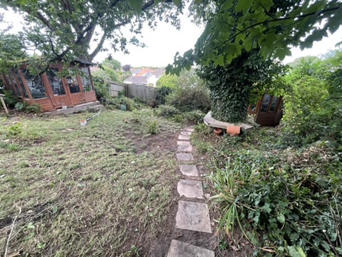 Lawn cleared and edged — back of garden